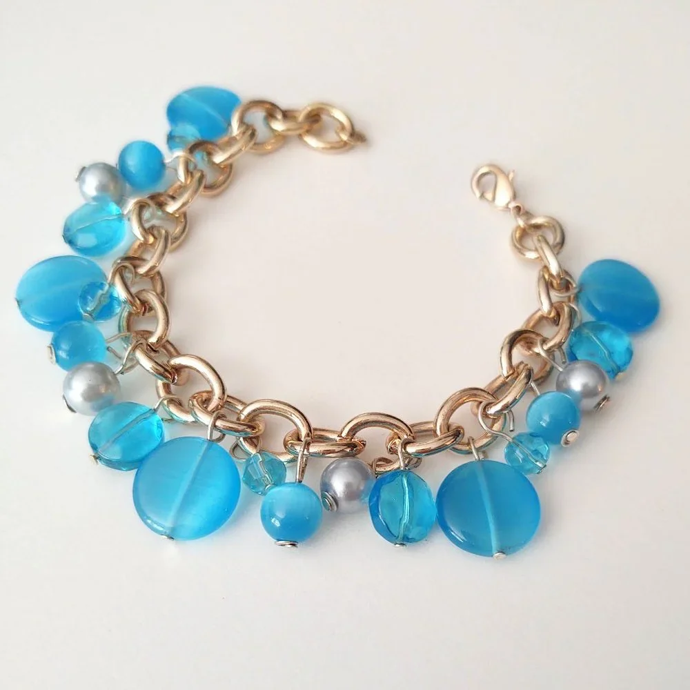 Blue bead and faux pearl charm style bracelet